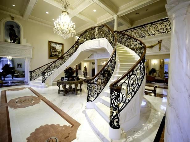 CORTLAND, OH-January 12: The front entryway and staircase at the Ross Home. The couple spent $250, 000 on the metal work for the staircase.  Brian and Kim Ross built their 75,000 sq ft home(including garages) a decade ago along a stream on 130 acres of property north of Youngstown.  The home has been an inviting refuge for the Rosses and their 3 children, and their friends.